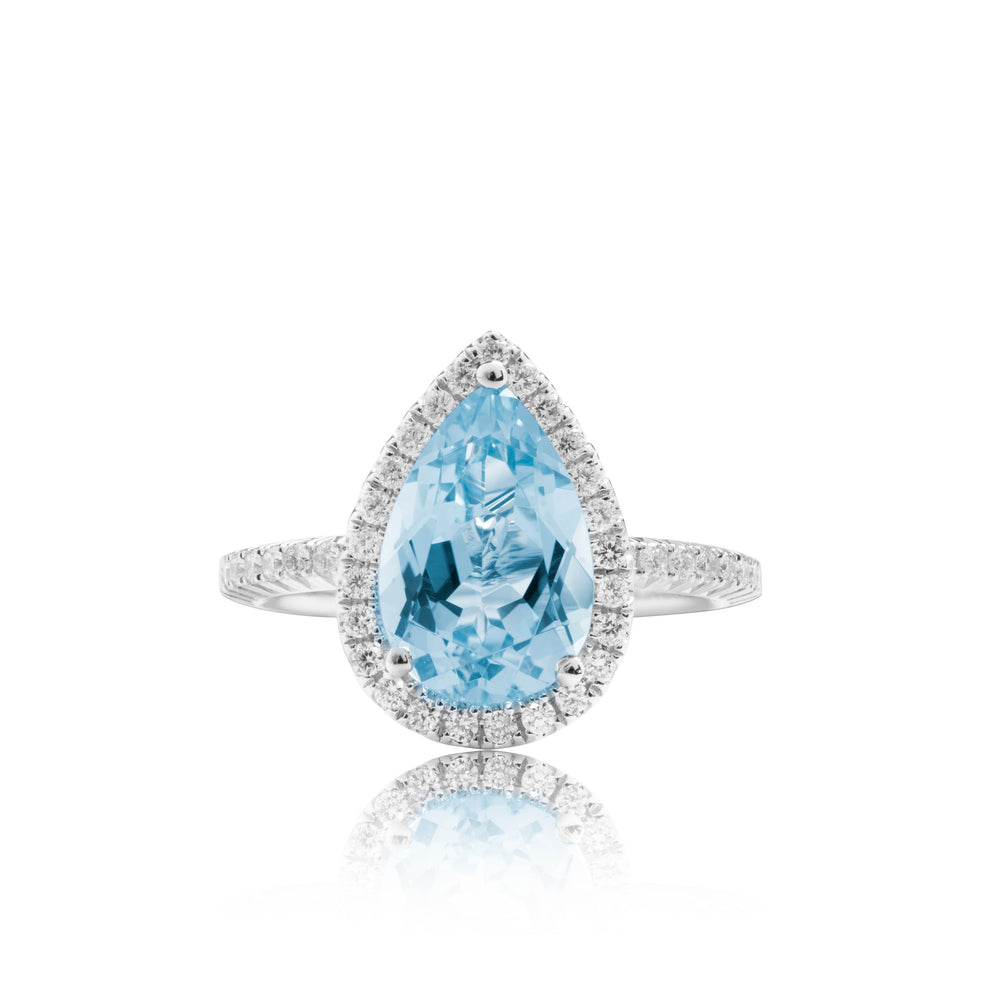 Pear shaped blue topaz halo diamond ring in 18k white gold